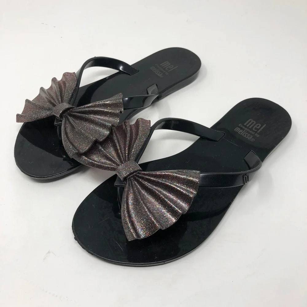 Melissa Mel Harmonic Bow Vi INF Flip Flops Girls 1 Black Glitter Scented